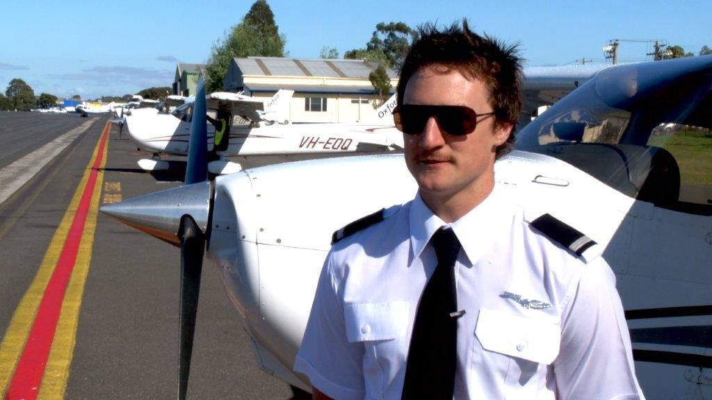 Student Pilot on airstrip giving a testimonial