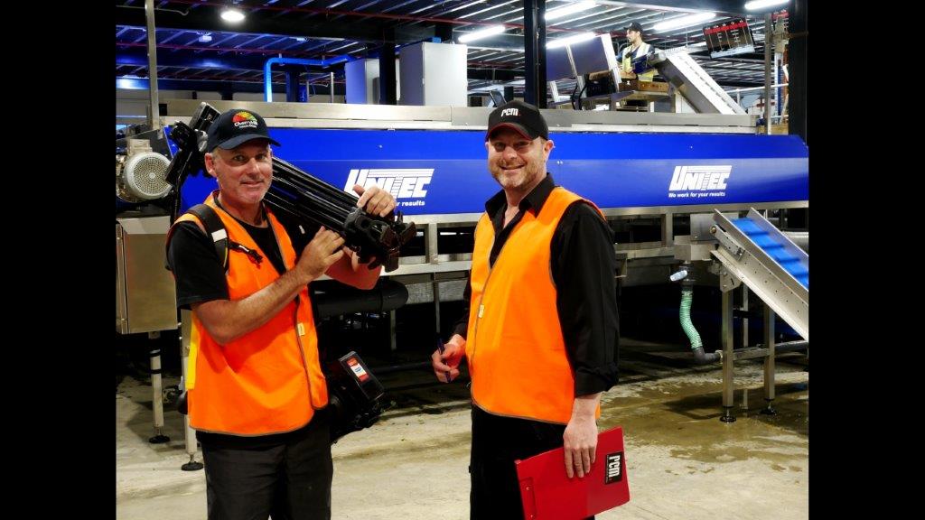 Director and Camera operator in cherry sorting factory