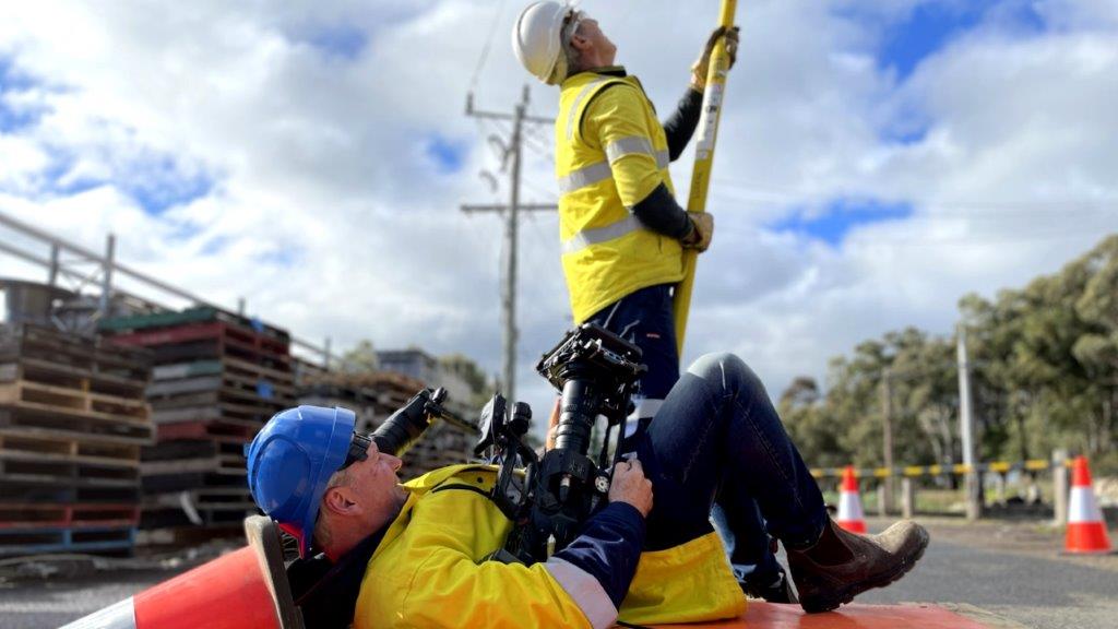 Camera Operator shooting lying on back