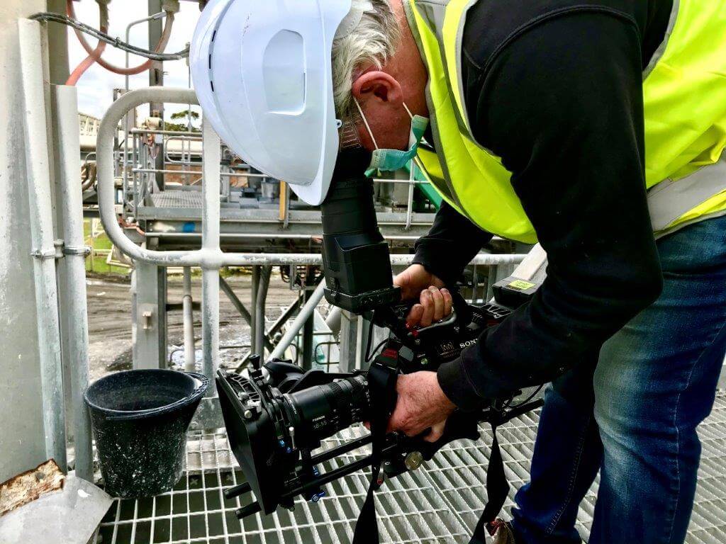 Camera Operator shooting at a paper mill