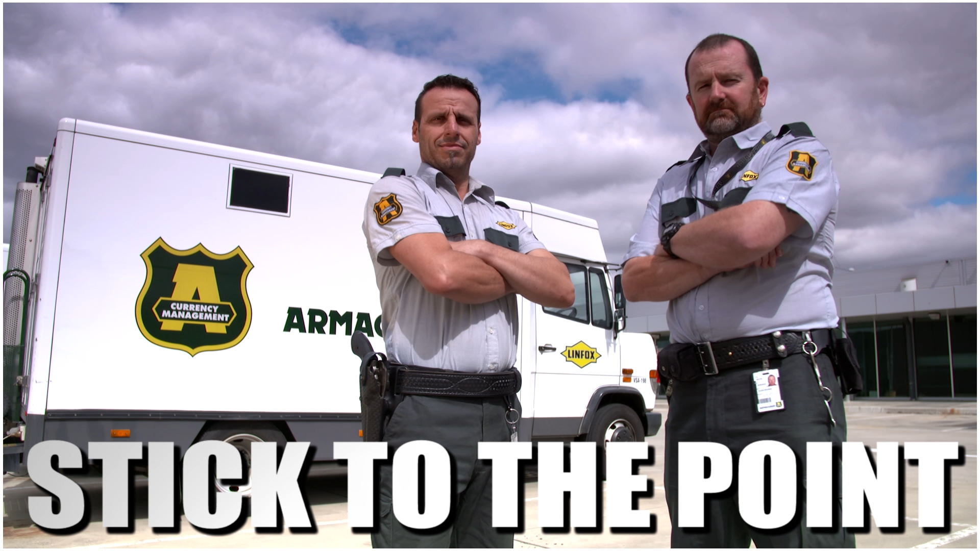 Tough security guards in front of truck